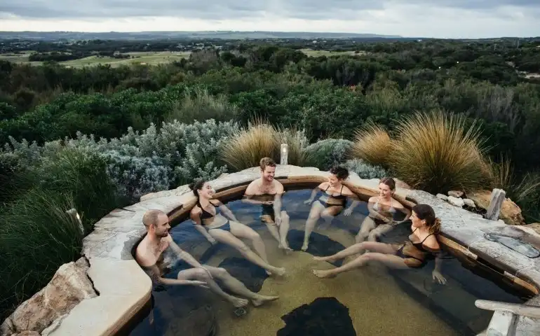 Bath-House-group-bathing-in-hilltop-pool